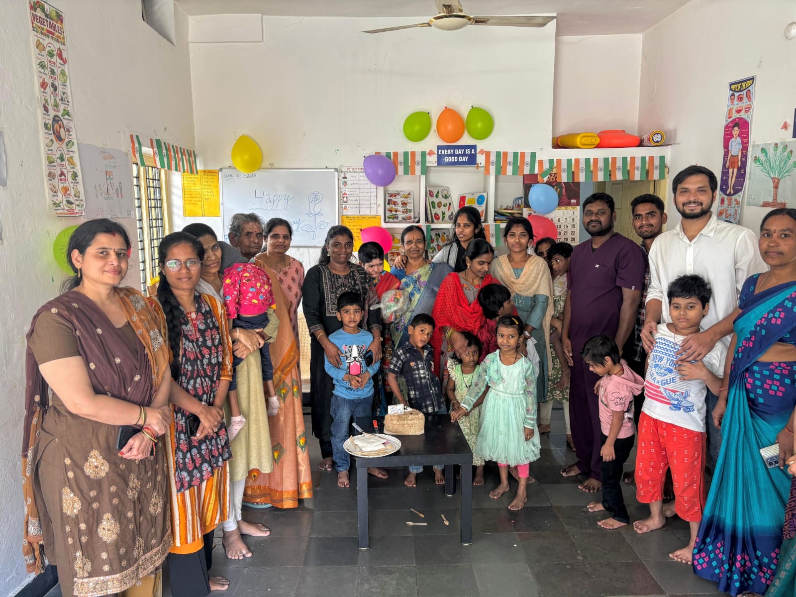 Families and children at a birthday celebration in the special school classroom